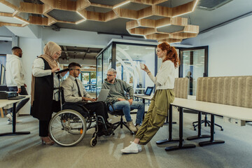 Young group of business people brainstorming together in a startup space, discussing business projects, investments, and solving challenges.