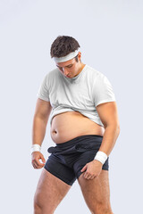 A funny fat man isolated on white background. Obesity and eating disorder. Concept for dietetics and fitness advertising in social networks.