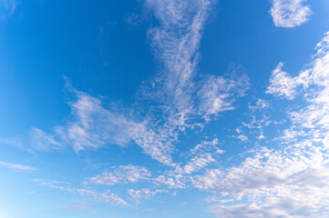 Blue sky and white fluffy tiny clouds background and pattern