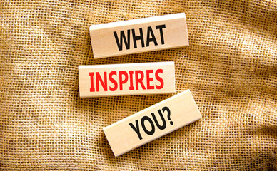 What inspires you symbol. Concept words What inspires you on wooden block. Beautiful canvas table canvas background. Business motivational what inspires you concept. Copy space.