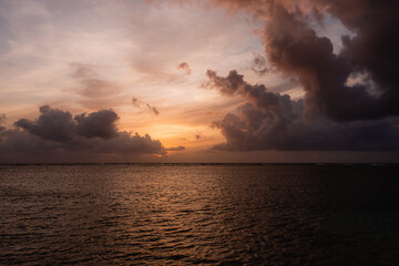 Naklejka na ściany i meble sunset sunrise over the sea with clouds