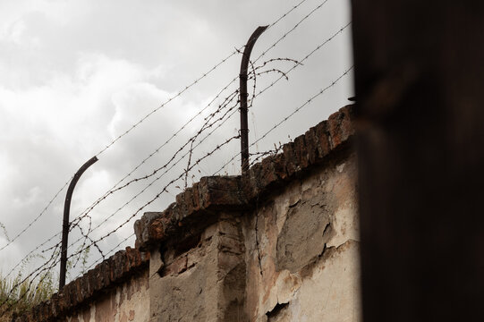 Barbed wire on wall of the Small Fortress, which served as a Prague Gestapo prison for opponents of the Nazi regime in 1940&mdash;1945. Terezin Memorial