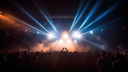 Glimpse of concert audience blocking stage lights