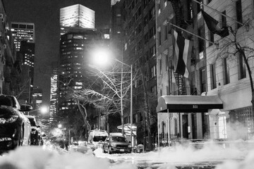 Black and White picture of a snowy street on a cold night in Brooklyn Heights, Brooklyn, New York...