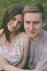 Obraz premium Portrait of happy couple outdoors in a park during the warmer months.