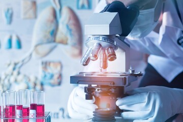 Doctor wear medical protective mask looking at blood samples under microscope