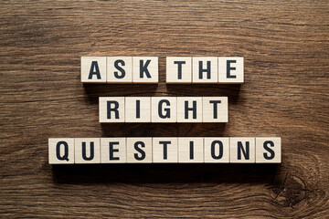 Ask the right questions - word concept on building blocks, text