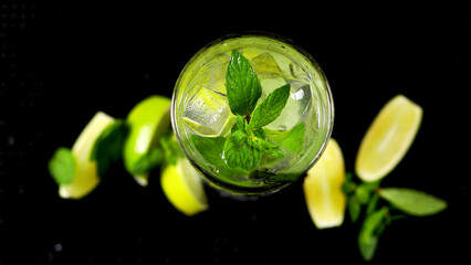 Camera Follows Ice cubes Falling into Glass of Fresh Mojito Cocktail. Super Slow Motion filmed on High Speed Cinema Camera.