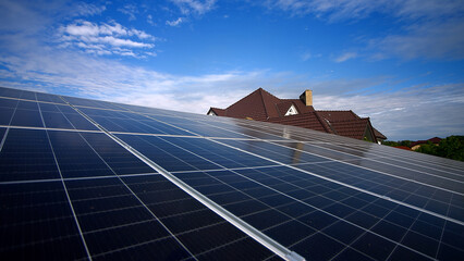 Solar panels and blue sky background. Solar panels farm on the roof and sunset. Photovoltaic...