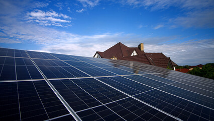 Solar panels and blue sky background. Solar panels farm on the roof and sunset. Photovoltaic...