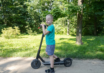 Kid fall when riding an electric scooter. Riding an e-scooter without protective gear. Increased risk of injury when using battery powered vehicles. Concept of problems in ensuring safety when driving