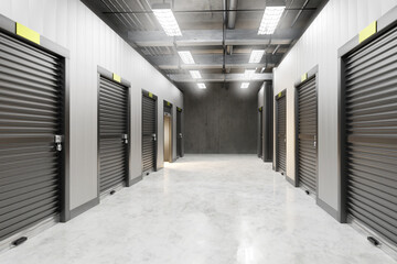 Storage rooms. Corridor with black shutters. Warehouse hangar interior. Background for storage rooms auction site. Warehouse building visualization. Closed storage rooms. 3d image.