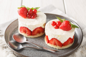 French strawberry Fraisier mini cakes closeup on the plate on the table. Horizontal