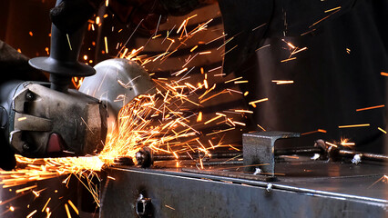 Factory worker welds metal. The man is welding. Welding with argon or electrode, using a welding...