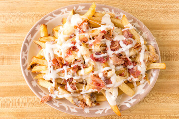 french fries with melted cheese and bacon