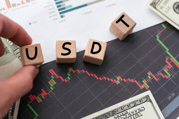 Word USD symbol concept and hand turn wooden block and change red arrow to green or vice versa