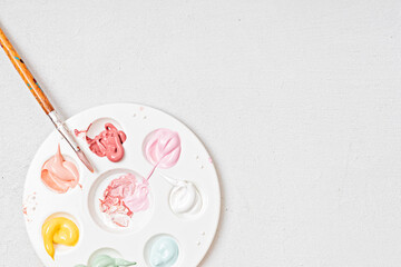 Artist painting palette with brushes. Craft hobby background. Recomforting, destressing hobby, art therapy