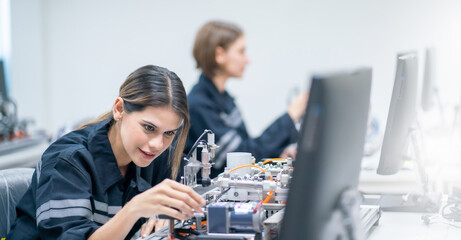 Mechanical engineering team working in robotic technology lap for research and develop for manufacturing automation and robotics.