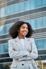 Happy smiling confident young African American professional business woman leader wearing suit...