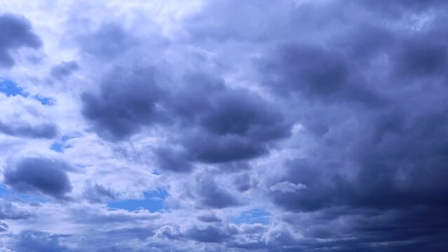 Timelapse dark clouds and strong winds before the rain. Moving rainy clouds, dark blue sky