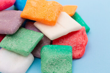 Rainbow Freeze Dried Candy Fruit Flavored Bar Candies on a Blue Background