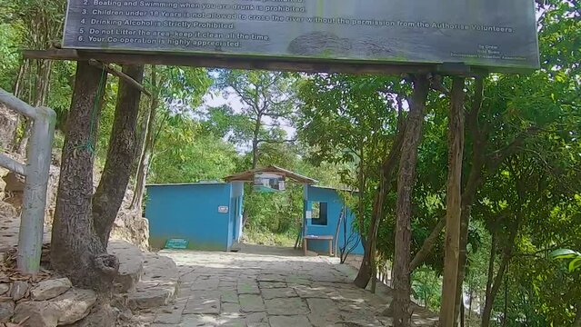 Krang Suri Falls entrance at dense forests at day from flat angle