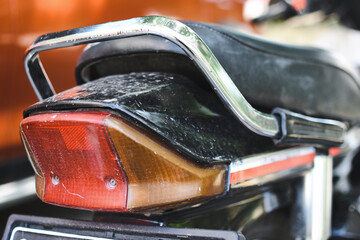 Vintage Honda motorcycle tail light, a classic design element that captures the essence of retro biking. 
