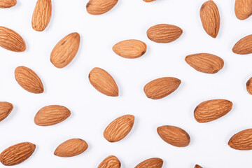 Almonds on a white background. Food pattern.
