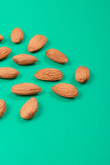 Almonds closeup on a turquoise background. 