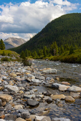 rocky river in the mountains of Canada on overcast cloudy day
