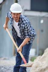 builder shovels on the road construction site