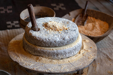 Ancient technology of millstones for grinding corn grains and seeds into flour. Ancient grain hand...