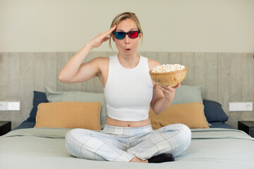 looking happy, astonished and surprised. film and popcorns concept
