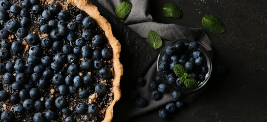Delicious blueberry pie on dark background