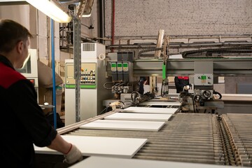 Industrial conveyor of modern furniture details in light factory