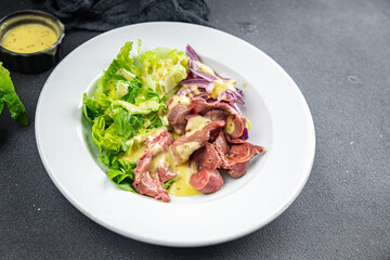 chicken stomach salad green lettuce, onion, salad dressing vegetable meal food snack on the table copy space food background rustic top view