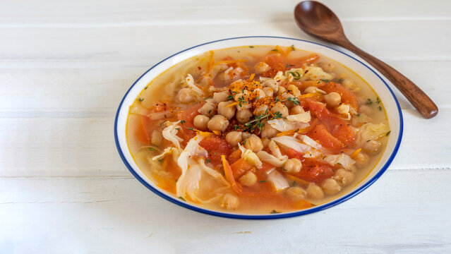 Chickpea Cabbage Tomato Soup in ceramic bowl. Moroccan style chickpea soup.
