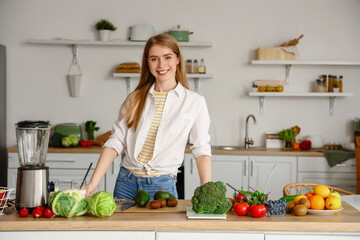 Young woman with healthy food in kitchen