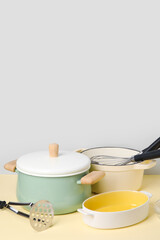 Set of different kitchen utensils on color background