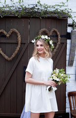 сountry bride in a white short dress in the village wedding, boho style.