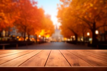  The empty wooden table top with blur background of the autumn landscape of the park © Uliana