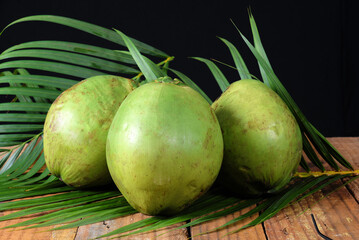 green coconut from Bahia Natural coconut juice tropical fruit in half fruit with tasty water on a...