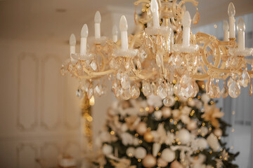 Enchanting New Year Elegance: Crystal Chandelier Sparkles Amidst Festive Christmas Splendor. Christmas interior