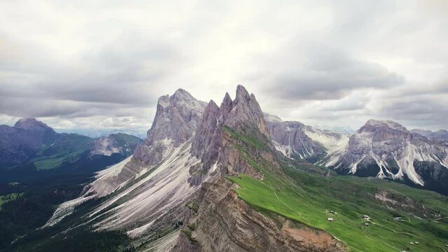 Aerial view of Seceda mountain ridge with tourists hikers, Dolomites
