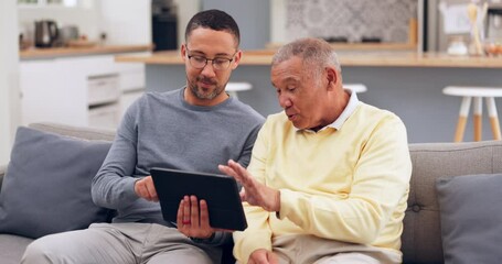 Tablet, conversation and man with his senior father on a sofa networking on social media together. Digital technology, living room and adult son helping his elderly dad browse the internet at home.