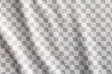 Gray checkered napkin. Tablecloth texture.