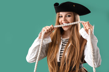 Beautiful female pirate with rope on green background
