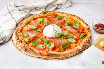 Tasty pizza with Burrata cheese on light background