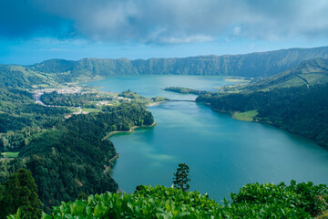 Sete Cidades: Discover the enchantment of Azores, Portugal, as this captivating town unveils breathtaking landscapes and the iconic twin lakes. High quality photo