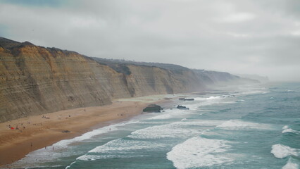 Stormy sea splashing landscape background. Dark ocean waves breaking in beach